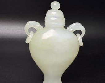 Exquisite hand-carved Chinese white jade vase with movable handles.