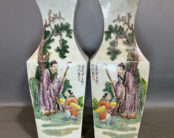 A pair of exquisitely hand-painted famille rose square vases depicting figures, made in the style of antique Chinese porcelain.