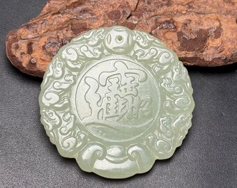 Exquisite double-sided jade pendant with auspicious beast motifs, hand-carved from Chinese white jade.
