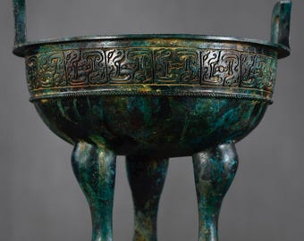 Exquisite bronze tripod sculpture, handcrafted from antique Chinese materials.
