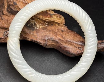 Exquisite hand-carved Chinese white jade bangle with twisted wire pattern