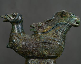 Exquisite bronze ram's head sculpture, handcrafted from antique Chinese materials.