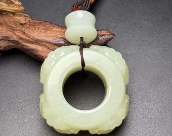 Exquisite four-sided jade animal thumb ring, hand-carved from Chinese white jade.
