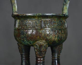 Exquisite bronze tripod sculpture with inscription, handcrafted from Chinese antiques.