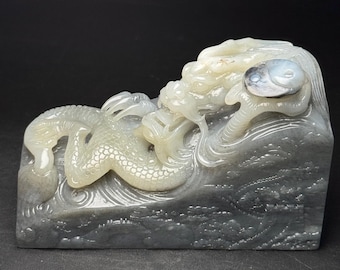 Exquisite Chinese white jade hand-carved blue-and-white dragon-shaped seal sculpture.