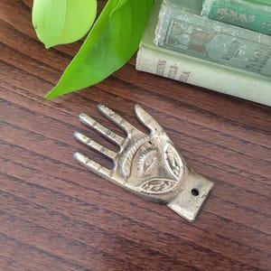 Brass hamsa wall decor with all-seeing eye // vintage Middle Eastern amulet // hand of Fatima // solid cast brass wall hanging