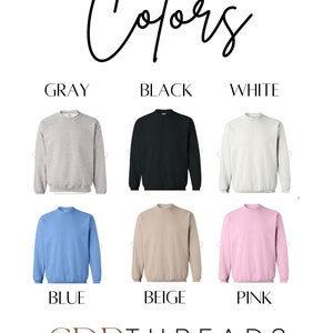 May include: A color chart showing different sweatshirt colors. The colors are gray, black, white, blue, beige, and pink. The text "Colors" is at the top of the image. The text "CDR Threads Creating Something Special" is at the bottom of the image.