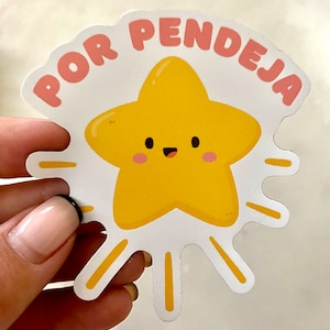 May include: A yellow star with a smiling face and pink cheeks, surrounded by yellow rays. The text "POR PENDEJA" is written in pink letters around the star.