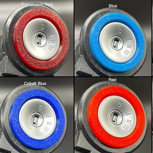 May include: Four different colored car key rings. The rings are translucent red, blue, cobalt blue, and red. Each ring has a silver keyhole with a small silver keyhole insert.