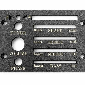 May include: A rectangular black textured metal control panel for an acoustic guitar preamp. It features labeled slots for SHAPE, TREBLE, MIDDLE, and BASS, plus circular holes for TUNER, VOLUME, and PHASE controls, with flat and sharp symbols printed.