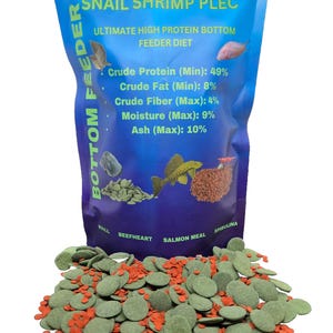 May include: A bag of green and orange fish food pellets labeled "Snail Shrimp Plec Ultimate High Protein Bottom Feeder Diet". The bag lists the nutritional content: Crude Protein (Min): 49%, Crude Fat (Min): 8%, Crude Fiber (Max): 4%, Moisture (Max): 9%, Ash (Max): 10%. The ingredients listed are: Krill, Beefheart, Salmon Meal, Spirulina.