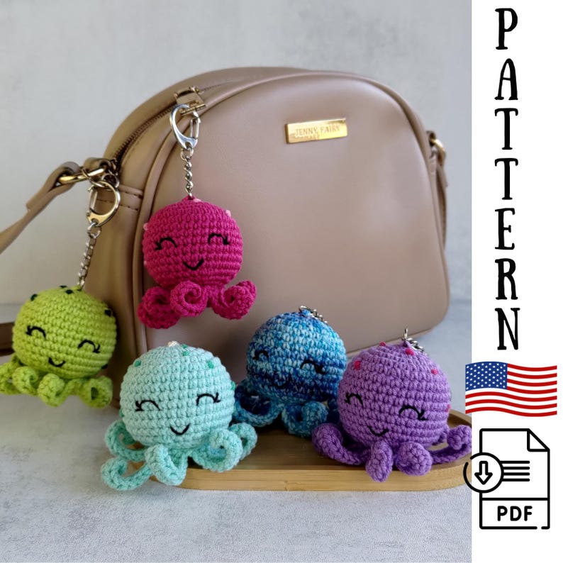 May include: Five crocheted octopus keyrings in different colours: green, teal, blue, purple, and pink. Each octopus has a smiling face and is attached to a silver keyring.