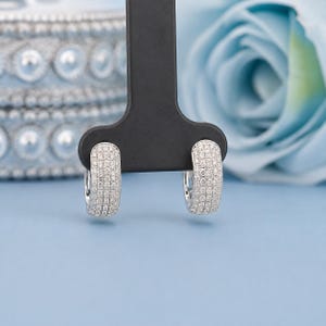 Add timeless sparkle to your jewelry collection with these elegant 14K white gold lab grown diamond hoop earrings. Designed with multiple rows of brilliant lab-grown diamonds, these hoops create a luxurious pavé look with exceptional shine from every angle.
