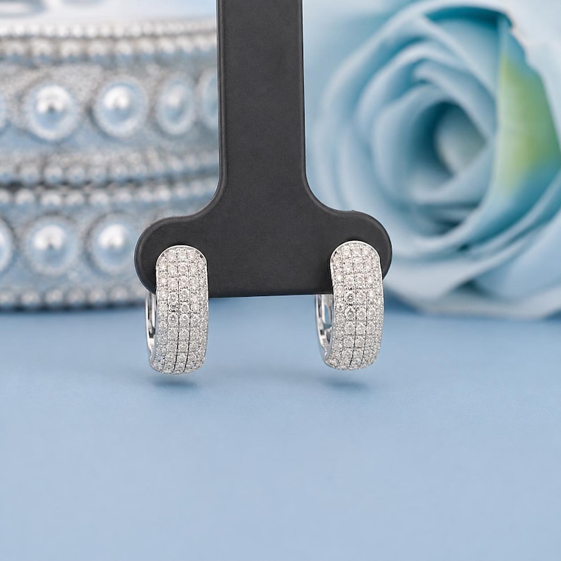 Add timeless sparkle to your jewelry collection with these elegant 14K white gold lab grown diamond hoop earrings. Designed with multiple rows of brilliant lab-grown diamonds, these hoops create a luxurious pavé look with exceptional shine from every angle.