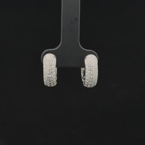 Add timeless sparkle to your jewelry collection with these elegant 14K white gold lab grown diamond hoop earrings. Designed with multiple rows of brilliant lab-grown diamonds, these hoops create a luxurious pavé look with exceptional shine from every angle.