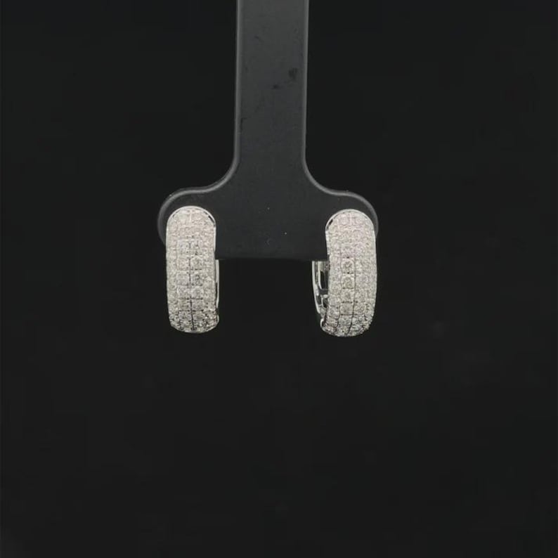Add timeless sparkle to your jewelry collection with these elegant 14K white gold lab grown diamond hoop earrings. Designed with multiple rows of brilliant lab-grown diamonds, these hoops create a luxurious pavé look with exceptional shine from every angle.