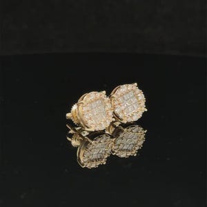 Add brilliant sparkle to your jewelry collection with these elegant 14K yellow gold lab grown diamond earrings. The round design features a sparkling center of carefully arranged lab-grown diamonds surrounded by a pavé diamond halo, creating a beautiful layered look with exceptional brilliance.