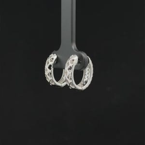 Add timeless sparkle to your jewelry collection with these elegant 14K white gold lab grown diamond hoop earrings. Designed with multiple rows of brilliant lab-grown diamonds, these hoops create a luxurious pavé look with exceptional shine from every angle.