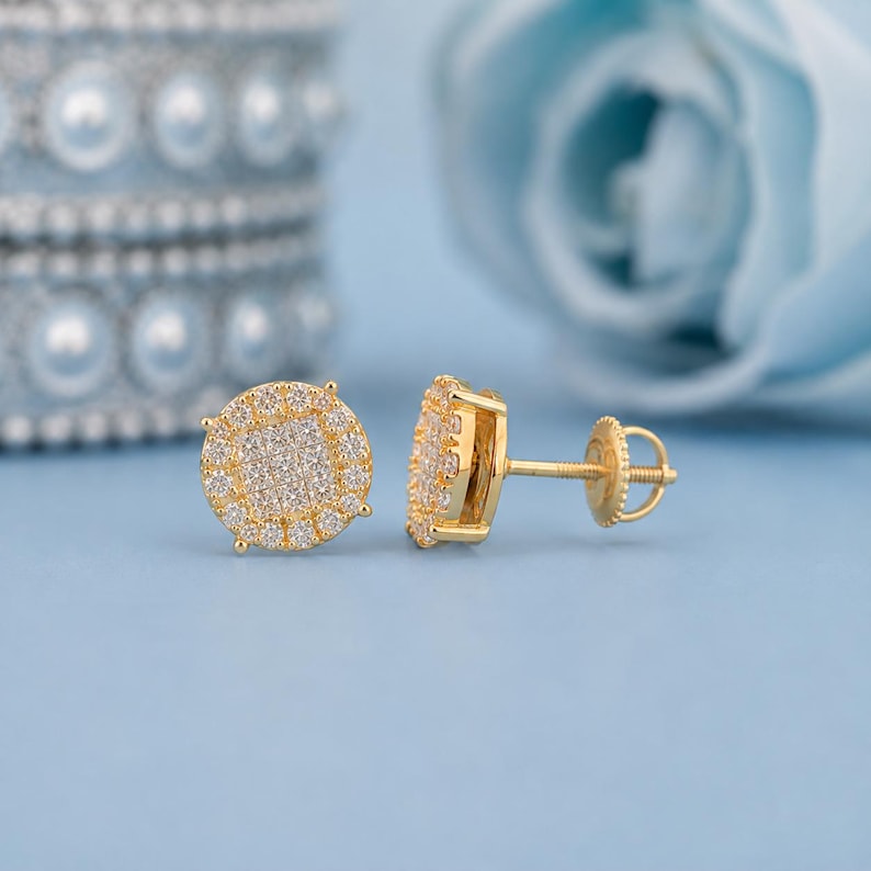 Add brilliant sparkle to your jewelry collection with these elegant 14K yellow gold lab grown diamond earrings. The round design features a sparkling center of carefully arranged lab-grown diamonds surrounded by a pavé diamond halo, creating a beautiful layered look with exceptional brilliance.