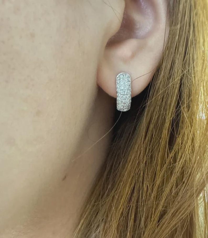 Add timeless sparkle to your jewelry collection with these elegant 14K white gold lab grown diamond hoop earrings. Designed with multiple rows of brilliant lab-grown diamonds, these hoops create a luxurious pavé look with exceptional shine from every angle.
