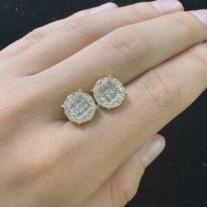 Add brilliant sparkle to your jewelry collection with these elegant 14K yellow gold lab grown diamond earrings. The round design features a sparkling center of carefully arranged lab-grown diamonds surrounded by a pavé diamond halo, creating a beautiful layered look with exceptional brilliance.
