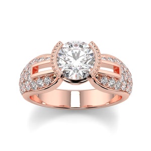 May include: A rose gold engagement ring with a large round center diamond and smaller diamonds set in the band.