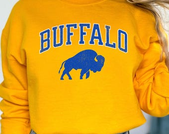 Sudadera unisex minimalista de cuello redondo con cuello redondo, estilo vintage desgastado y curvado Buffalo Curved Heavy Blend™