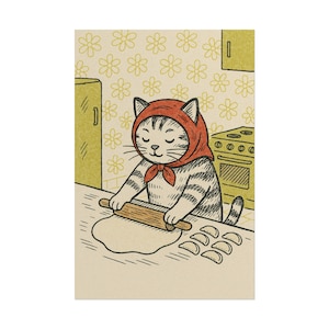 May include: An illustration of a cat wearing a red headscarf, rolling out dough with a wooden rolling pin in a kitchen. There is a stove, cabinet, and several dumplings on the counter.