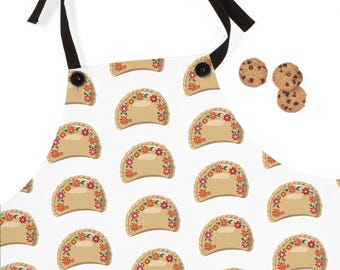 May include: A white apron with a repeating pattern of brown and beige pastry pockets with red and orange floral embroidery.