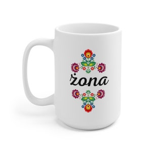 May include: White ceramic mug with a colorful floral design and the word "żona" in black script.