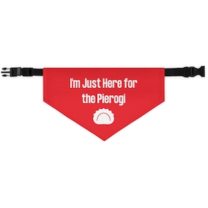 May include: Red dog bandana with white text that reads "I'm Just Here for the Pierogi" and a white pierogi graphic.
