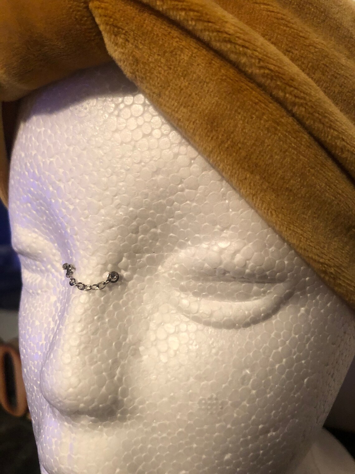 bridge piercing with chain