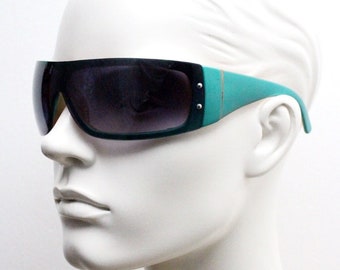 Y2K vintage visor sunglasses. Black massive mask mono lens wrap around shield with turquoise arms. Sick fashion grail. 2000s unused NOS