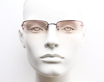 Y2K vintage wrap around rectangular sunglasses. Half frame in sharp chrome with extra light tone pink lenses. Rave 2000's. 00's NOS