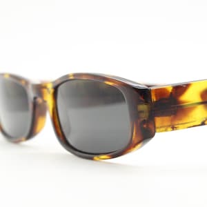 90s vintage rectangular sunglasses. Authentic and sharp low profile vibrant tortoise frame with full height arms. BNWT Unused NOS