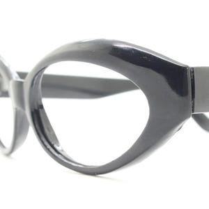 80s vintage oval cat eye glasses. Crop sided dynamic black cateye optical frames. 60s design prescription eyeglasses. RX spectacles. NOS