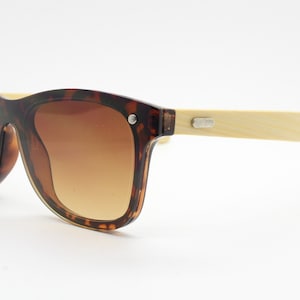 Vintage Y2K modified wayfarer style hand made sunglasses. Tortoise flat front monolens design with real wooden arms. Unused NOS
