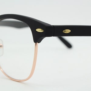 90s vintage browline sunglasses. All time classic design in black gloss finish with gold half rim. 50s, 60s. Unused NOS