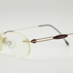 Silhouette rectangular frameless eye glasses made in Austria. Minimal lightweight titanium optical frame. Prescription RX spectacles