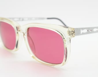 90s vintage futuristic crystal  sunglasses. Rectangular transparent frame with extraordinary arm cut outs and shocking pink lenses. NOS