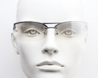 Y2K vintage wraparound sunglasses. Sick fashion grail half frame in silver chrome with extra light tone curving mirrored lenses. 2000's NOS