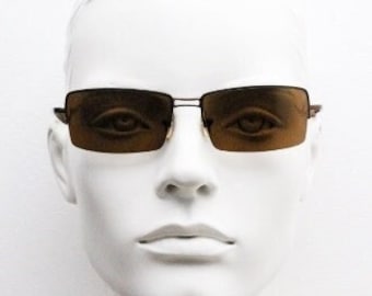 Y2K vintage curved rectangular sunglasses. Minimal half frame in brown chrome with mid tone lenses and straight arms. 2000's. 00's NOS