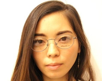 Eddie Bauer 90s vintage oval eye glasses.Grey matt finish optical frames with subtle brown trim. Prescription RX spectacles. NOS