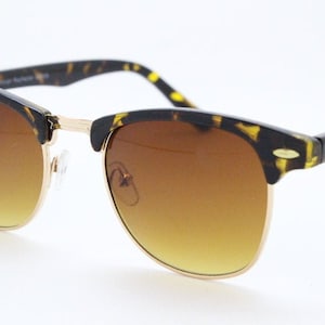 90s vintage browline sunglasses. All time classic design in tortoise gloss with gold half rim. 50s, 60s. Unused NOS