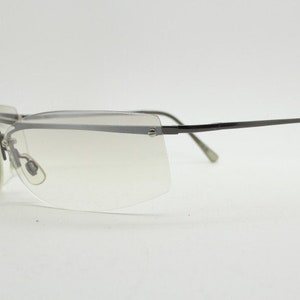 Y2K vintage wraparound sunglasses. Sick fashion grail half frame in grey chrome with extra light tone curving mirrored lenses. 2000&#39;s NOS