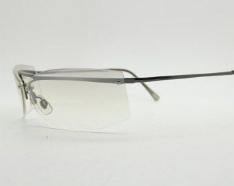 Y2K vintage wraparound sunglasses. Sick fashion grail half frame in grey chrome with extra light tone curving mirrored lenses. 2000's NOS