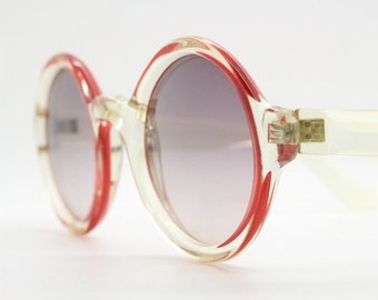 Mary Quant 60s vintage round sunglasses made in France. Yellow crystal transparent lucite frame in with contrasting dark graduating lenses