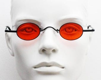 90s vintage small oval sunglasses. Imposing minimal black gloss metal victorian antique style frame with bright red lenses. Steampunk. NOS