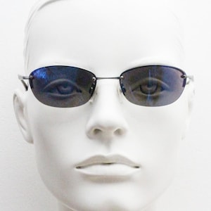 90s vintage small bug eye oval sunglasses. Minimal silver satin finish solid metal half frame with blue mirror lenses. Y2K.  NOS sample