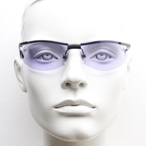 May include: A pair of rimless sunglasses with a black frame and light purple lenses.